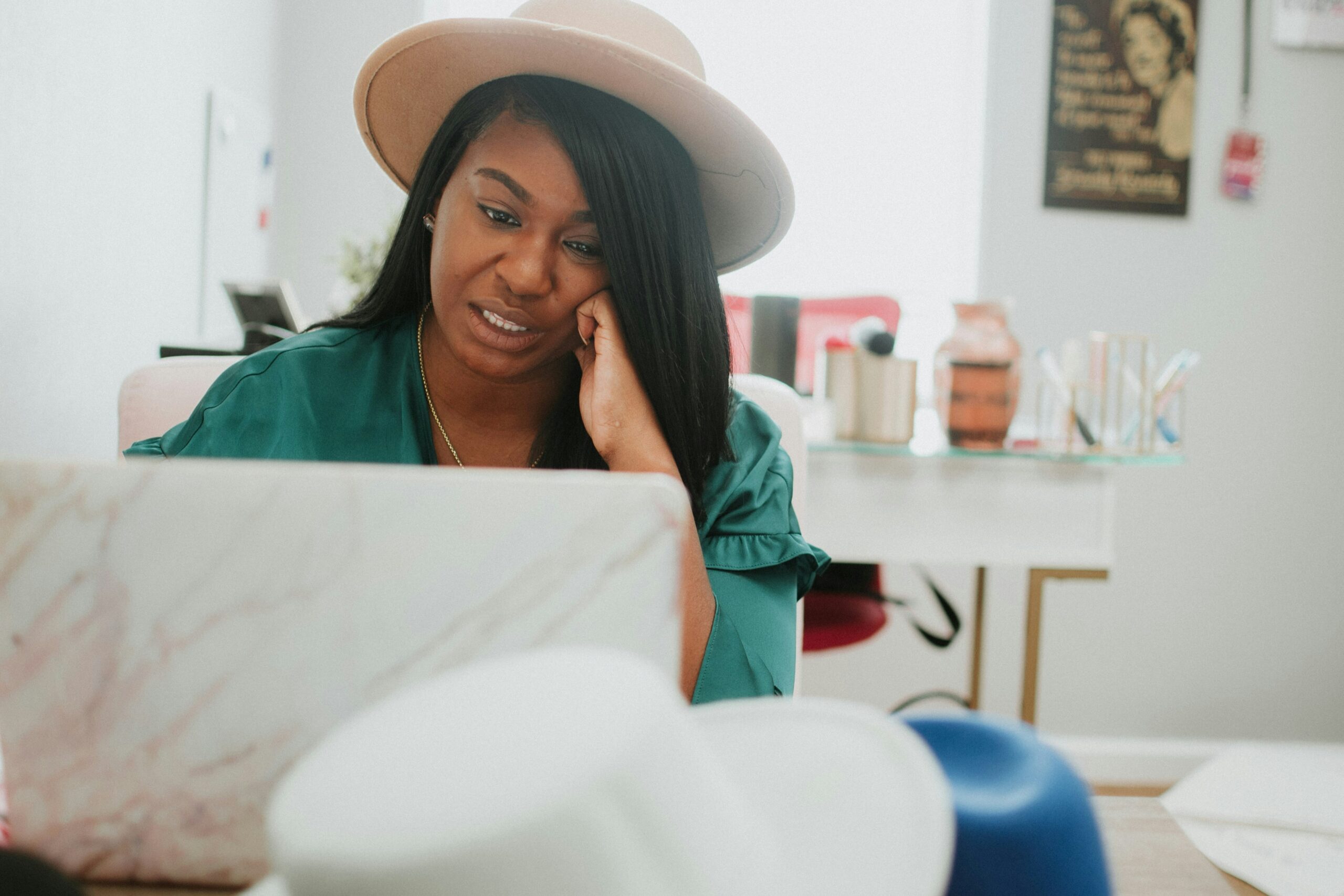 woman sitting at desk with laptop